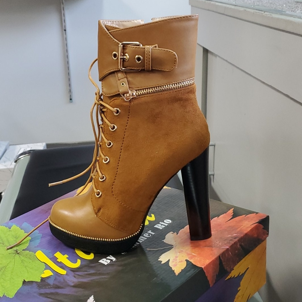 Brown strapped in boot